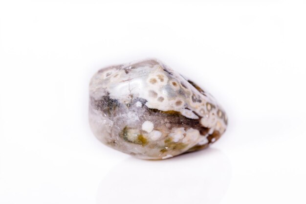 Macro mineral stone Jasper oceanic on a white background