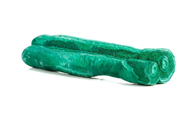 Macro mineral stone malachite stalactite on white background