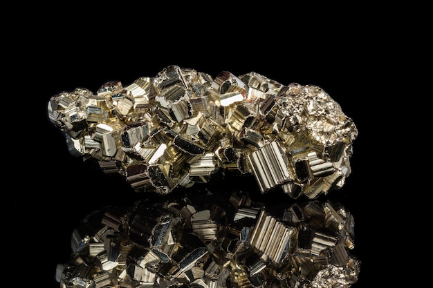 Macro mineral stone Pyrite on a black background