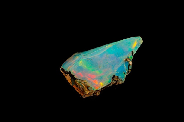 Macro mineral stone rare and beautiful opals on a black background