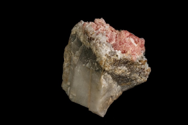 Macro of the mineral stone Rhodochrosite with fluorite on a black background