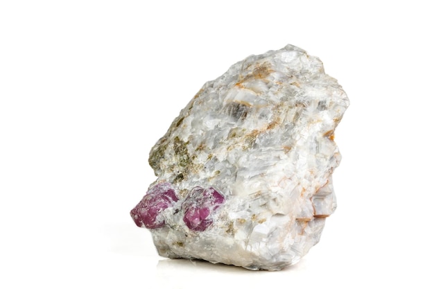 Macro mineral stone Ruby in rock on white background