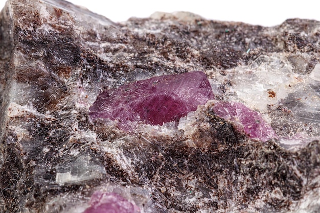 Macro mineral stone ruby on a white background