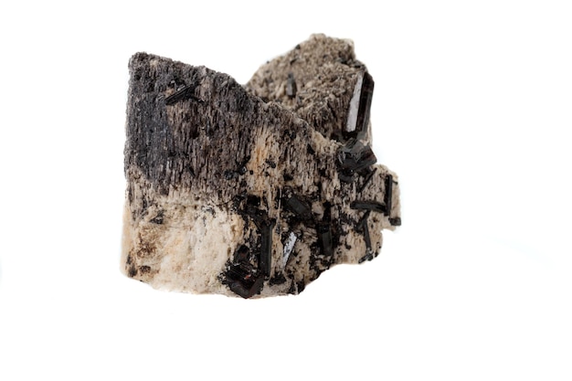 Macro mineral stone Schorl Black Tourmaline on the feldspar on a white background