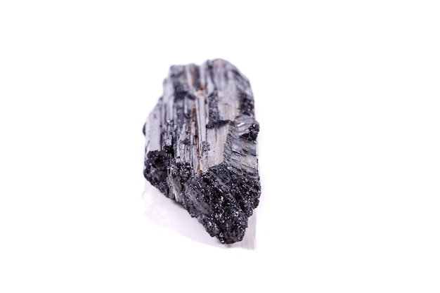 Macro mineral stone sherle schorl black tourmaline on white background