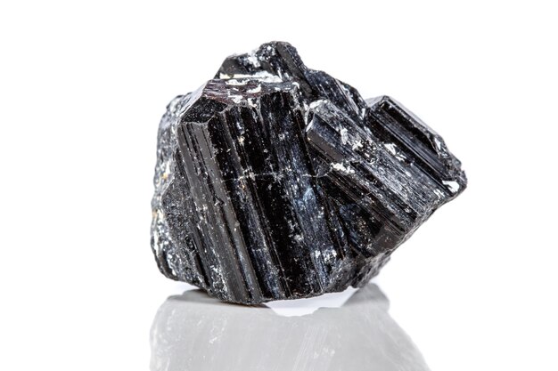 Macro mineral stone sherle schorl black tourmaline on white background