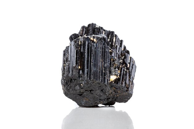 Macro mineral stone sherle schorl black tourmaline on white background