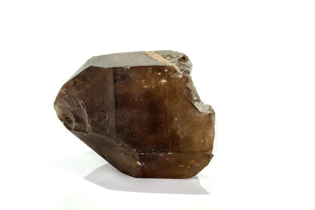 Macro mineral stone smoky quartz rauchtopaz on a white background