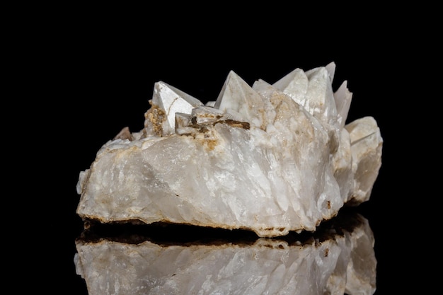 Macro mineral stone Snow quartz with calcite on a black background