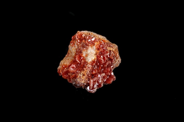 Macro mineral stone Vanadinite on a black background