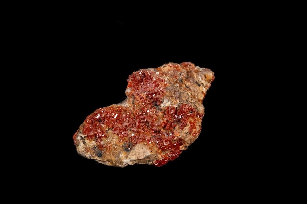 Macro mineral stone Vanadinite on a black background