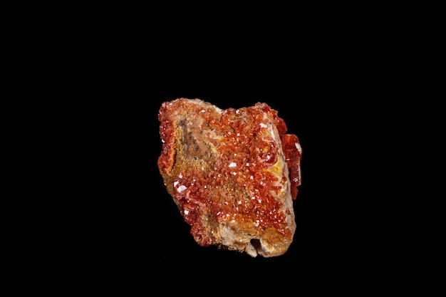 Macro mineral stone Vanadinite on a black background