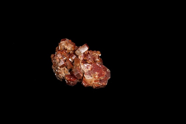 Macro mineral stone Vanadinite on a black background