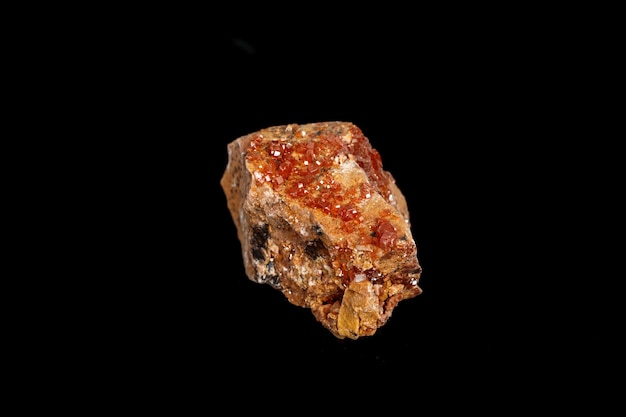 Macro mineral stone Vanadinite on a black background