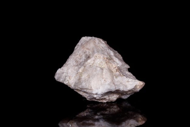 Macro mineral stone Wollastonite on black background close up