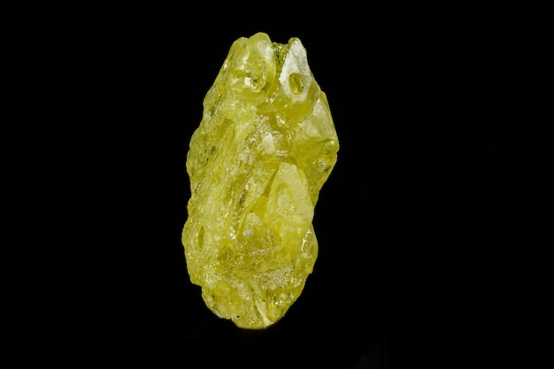 Macro mineral sulfur stone on a black background