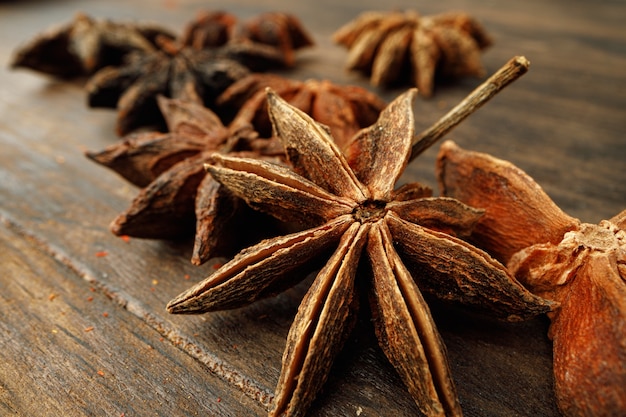 Macro photo of anise stars on wooden