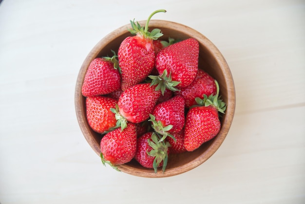 Macro photo of a ripe red large strawberry with a small depth of field