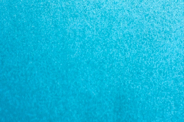 Macro photography of blue spray paint on white paper