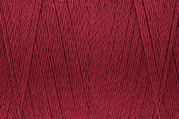 Macro picture of thread texture red crimson color background