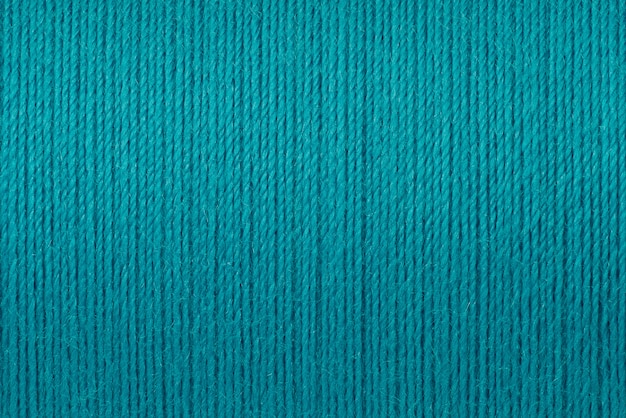 Macro picture of turquoise thread texture background