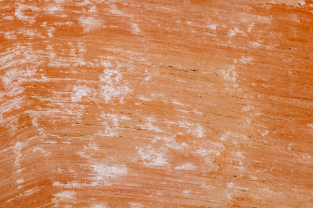 Macro pink plaster mineral stone on white background