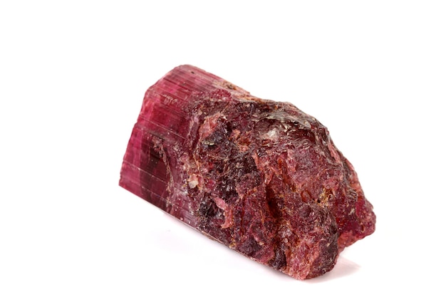 Macro red tourmaline mineral stone on white background