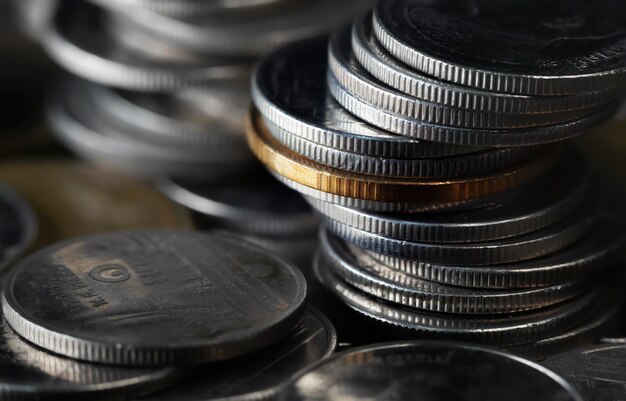 Macro shot of a large quantity of Thai baht coinsSaving glass jar Saving money concept on white background exchange investment as concept