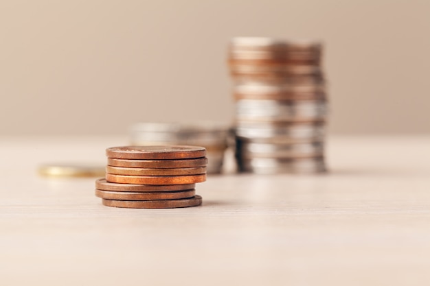 Macro shot  of unrecognizable coins stacked close up 