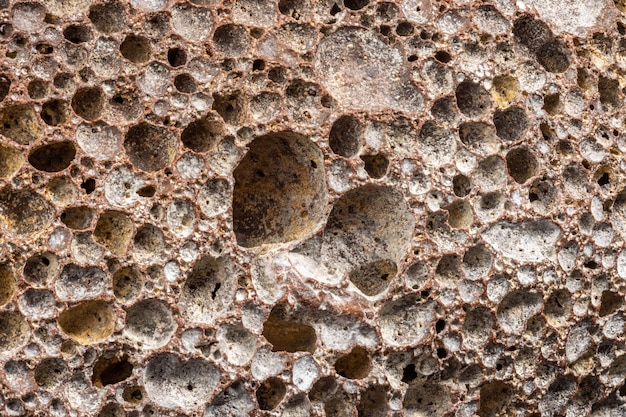 Macro shot of used pumice stone with dirt and dead skin inside pores