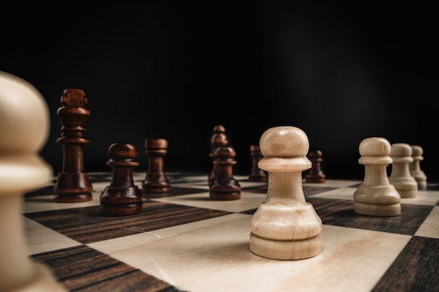 Macro shot of wooden chess figures on chess board