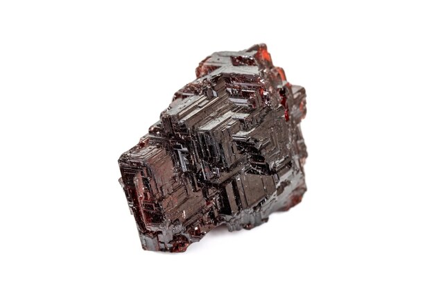 Macro stone Garnet mineral in rock on a white background