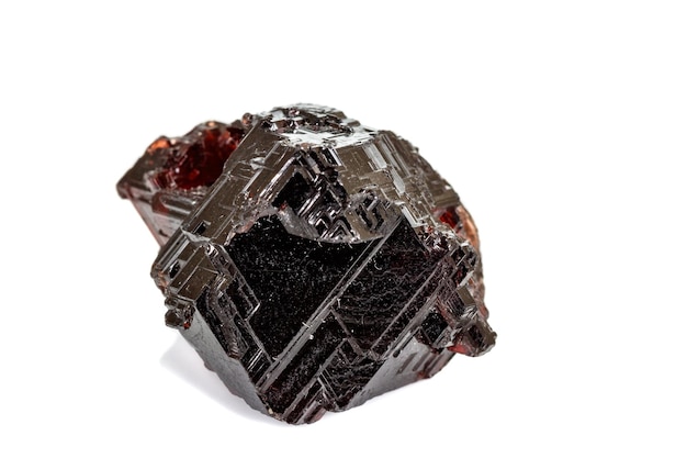 Macro stone Garnet mineral in rock on a white background