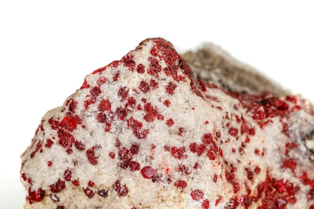 Macro stone mineral Cinnabar on a white background close up