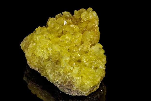 Macro of a sulfur mineral stone on a black background