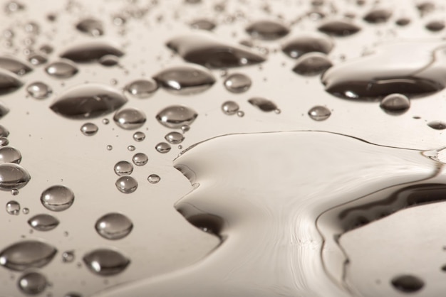 Macro water drops macro photo of water drops on a reflective surface selective focus