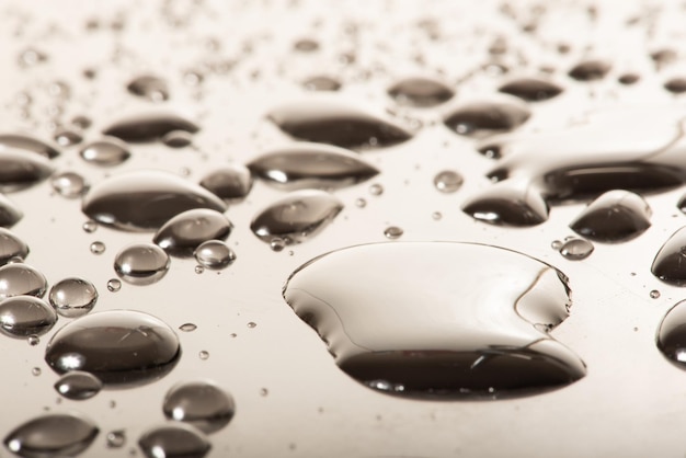 Macro water drops macro photo of water drops on a reflective surface selective focus