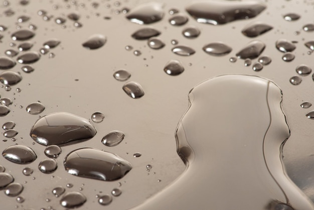 Macro water drops macro photo of water drops on a reflective surface selective focus