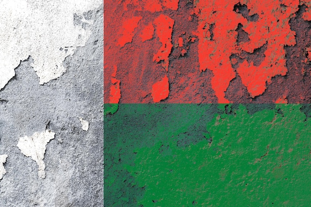 Madagascar flag painted on a damaged old wall surface