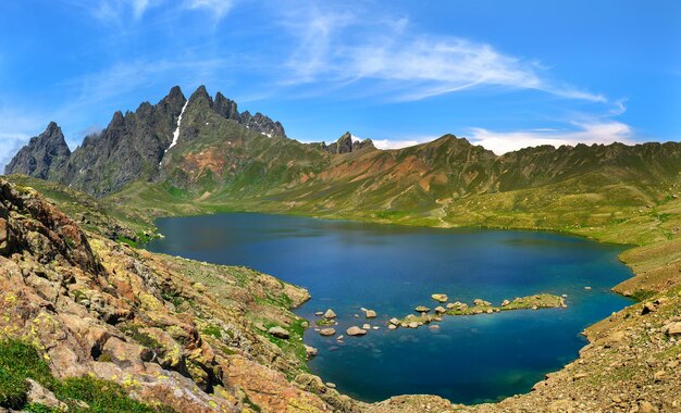 Magic blue lake in the mountains of Georgia fills the whole valley