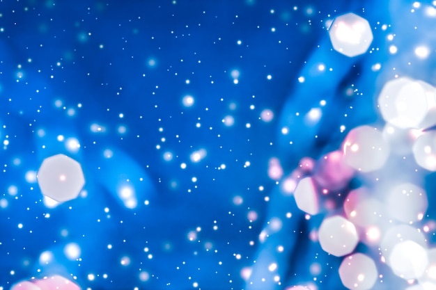 Magic sparkling shiny glitter and glowing snow luxury winter holiday background