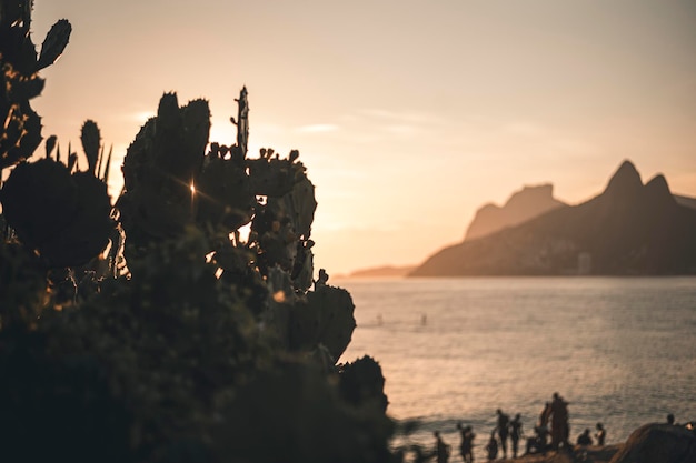 A magical place: People applaud when the sun sets at Arpoador rock with view of Ipanema beach and the Mountains of Morro Dois Irmaos and Leblon in the back. Camera: Leica M10