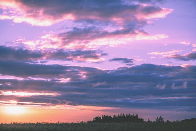 Magical sunset in the countryside Rural landscape in the evening