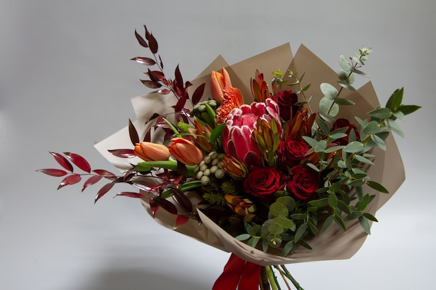 Magnificent bouquet of tulip, leucospermum, leucadendron, protea, rose , selective focus