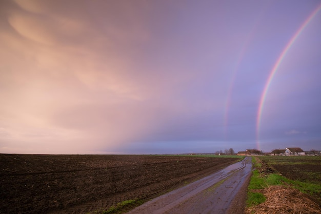 Magnificent Double Rainbow in the Stormy Sky An extraordinary perspective of a magical moment in nature