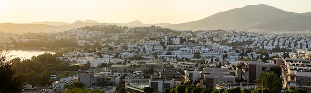 A magnificent landscape with a view of the city of Gumbet in the setting sun.