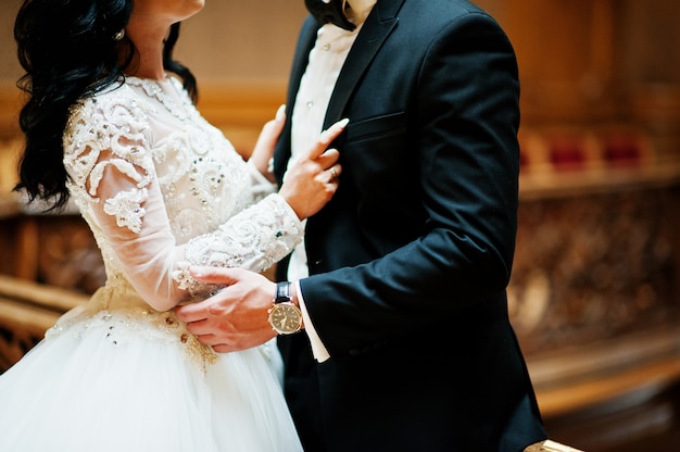 Magnificent wedding pair newlywed at rich wooden royal palace.