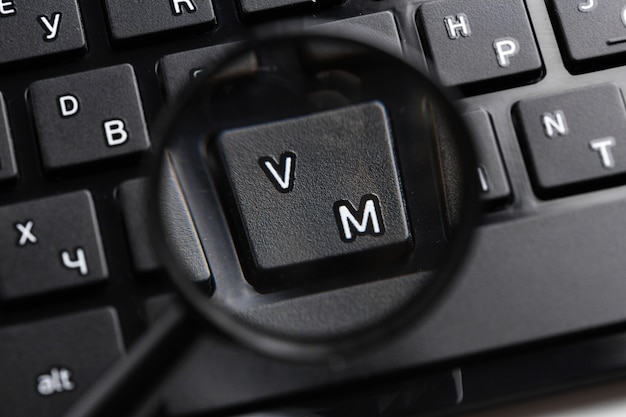 Magnifying Glass on black keyboard