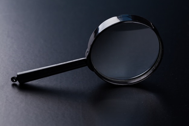 Magnifying glass on dark 