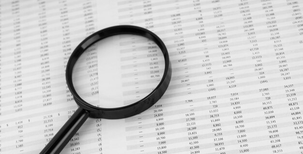 Magnifying glass on financial statement